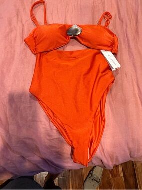 Stylish Orange Women’s One-Piece Swimsuit with Decorative Accent